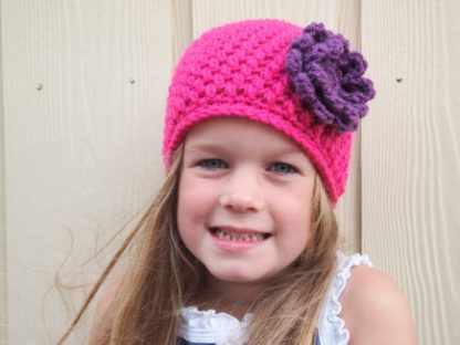 Fuchsia beanie muts.